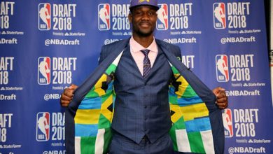 Ayton with the Bahamas and Nigeria flag suit