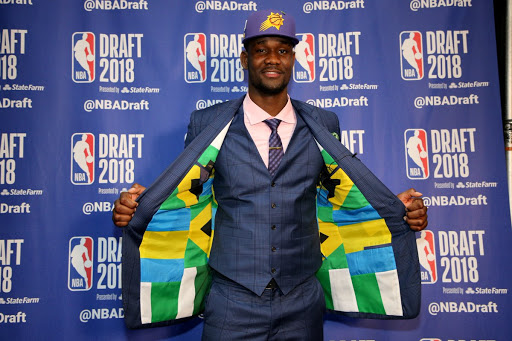 Ayton with the Bahamas and Nigeria flag suit