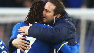 Alex Iwobi and Frank Lampard hugging after a huge win