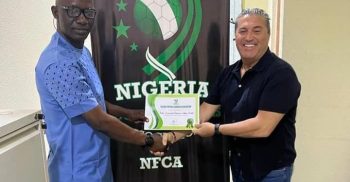 Bosso presents Paseiro with his NFCA membership certificate