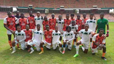 Golden Eaglets and Pride FC players after the Friendly game on Saturday