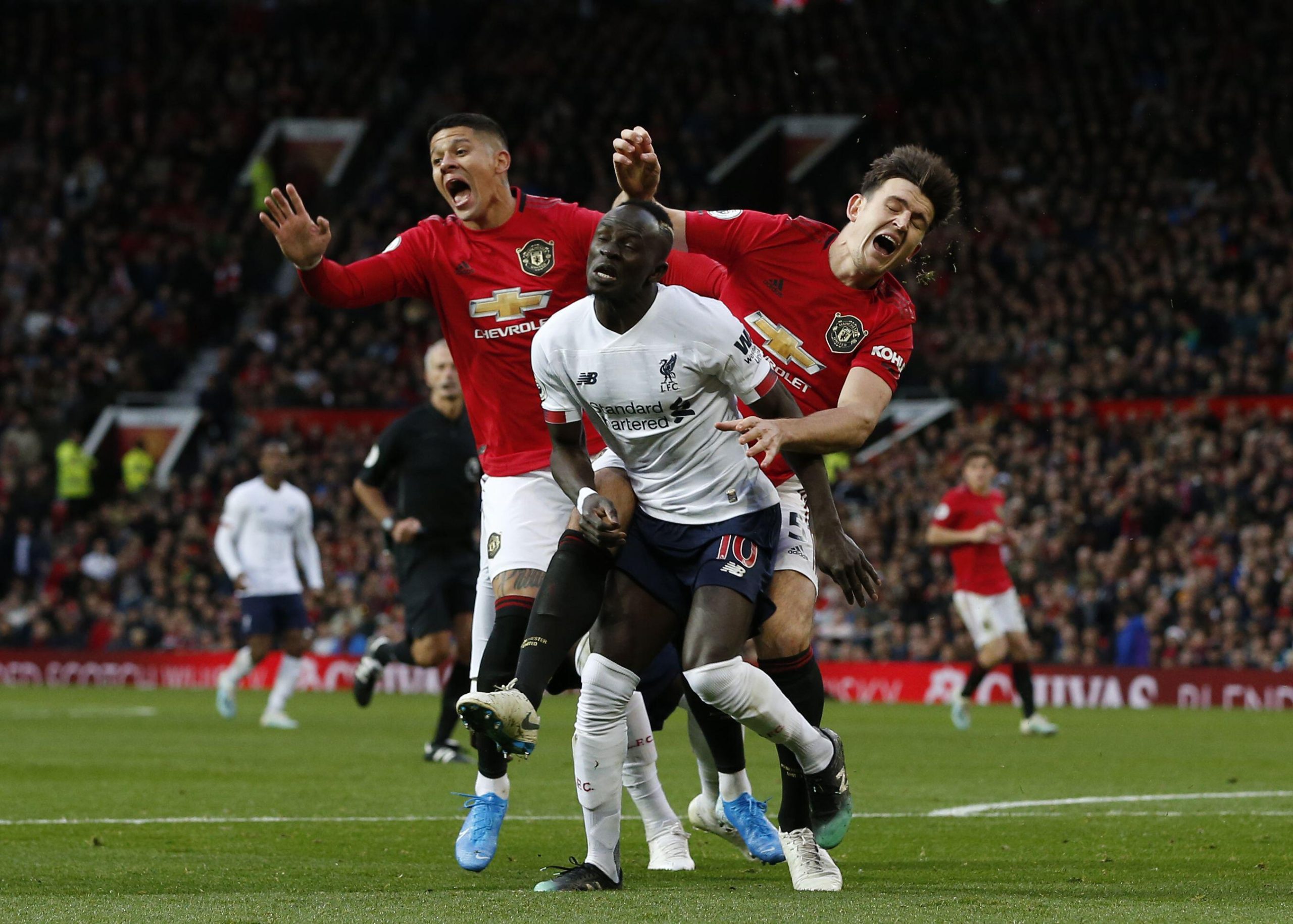 Marcos Rojo and Harry Maguire in action for Manchester United