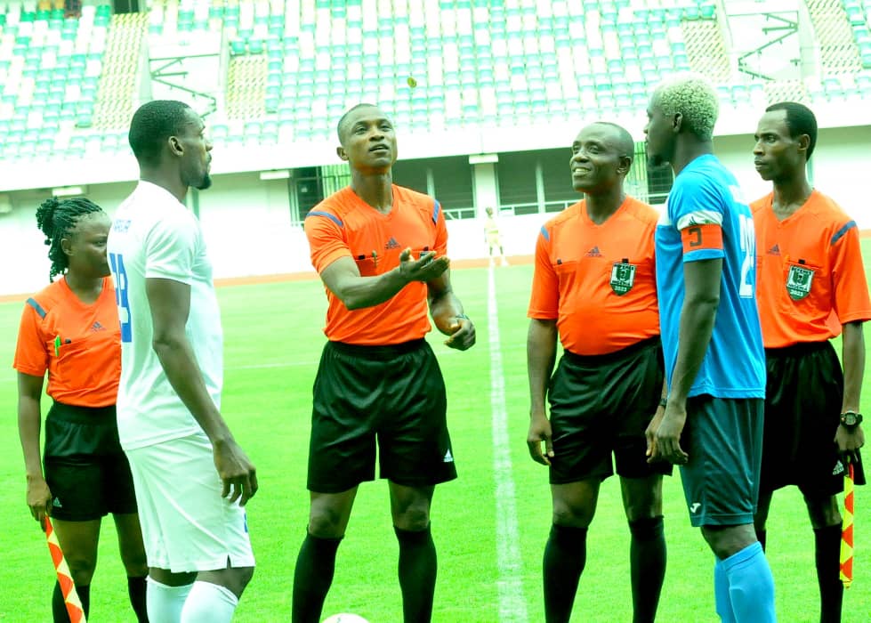 Referees Akaniyene Udoette, Uboho Sunday, Mfon Akpan (FIFA) and Ben Onyika with captains of Rivers United and Enyimba FC