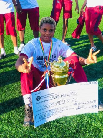 Anams Lillian with the Benin Republic Women's League title won by her club Sam Nelly FC