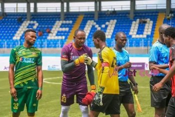 FATHER BEHOLD YOUR SON; Dele Aiyenugba exchanging banters with his son before the ValueJet pre-season tournament semi-final.