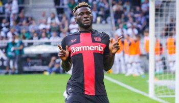 Victor Boniface celebrates a goal for Bayer Leverkusen.