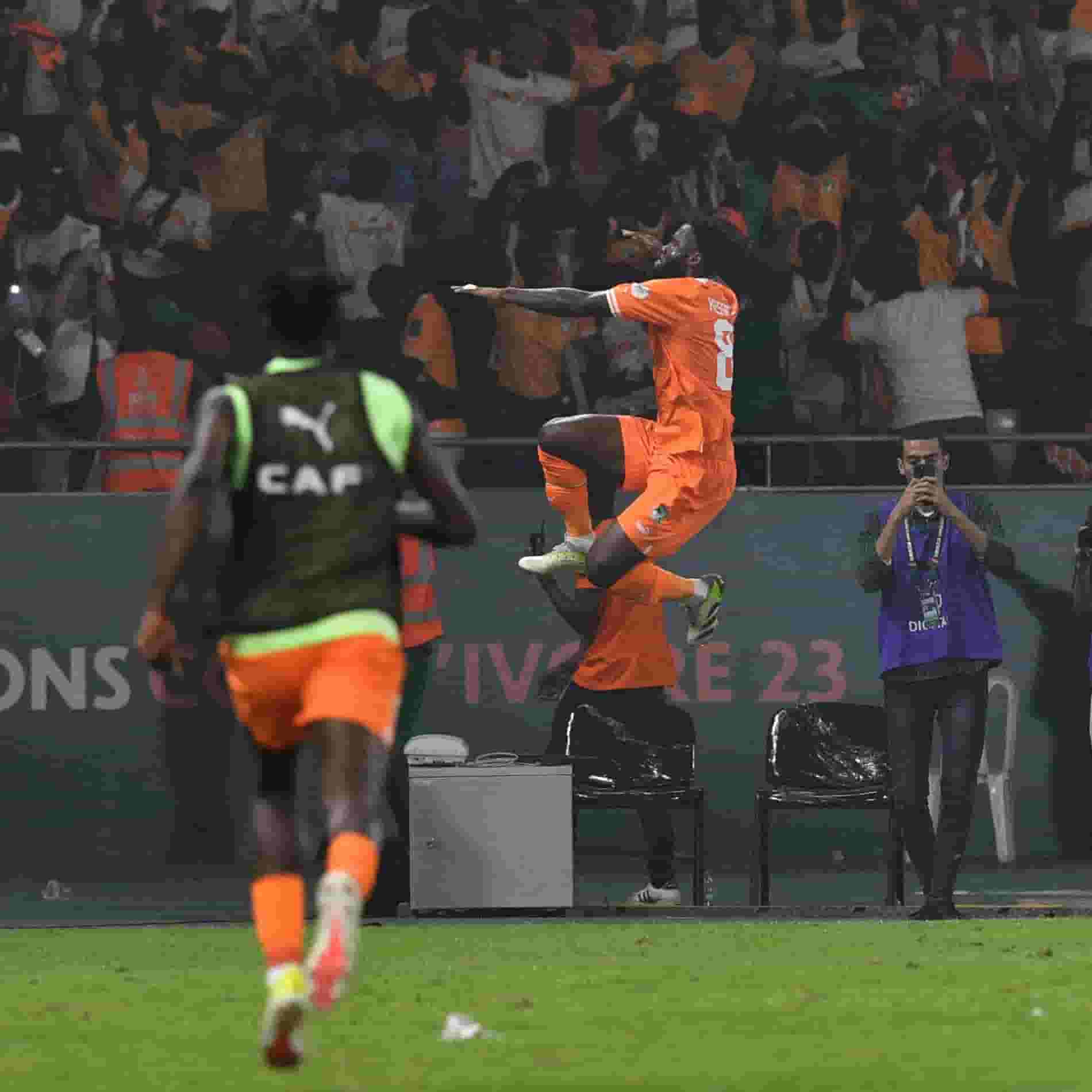 Ivory Coast Eliminates Defending Champions Senegal from AFCON In a dramatic encounter, Ivory Coast eliminated defending champions Senegal from the 2023 Africa Cup of Nations (AFCON) in a penalty shootout. The match ended 1-1 after extra time, with Ivory Coast securing a 4-5 victory in the penalty shootout. Senegal took an early lead with a goal from Habib Diallo in the 4th minute, putting them in a favorable position. However, Ivory Coast fought back, and in the 86th minute, substitute Franck Kessie scored from the penalty spot to level the scores at 1-1. The game proceeded to extra time, but neither team could find a decisive goal. The fate of the match was then determined by a penalty shootout, where Ivory Coast emerged victorious with a 4-5 score. Ivory Coast's goalkeeper, Franck Kessie, played a crucial role in the penalty shootout, both scoring a penalty and saving one, contributing to the host nation's triumph over the defending champions. The result sparked wild celebrations in the stands and across the country, as Ivory Coast advanced to the next stage of the tournament.