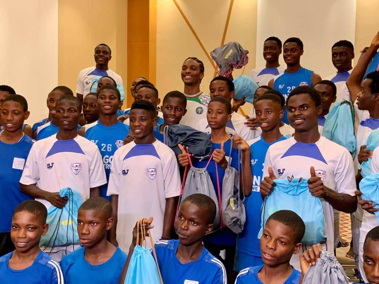 Super Eagles Captain Troost-Ekong and Actor Natse Jemide Surprise Blessed Stars Academy Players with Memorable Gifts