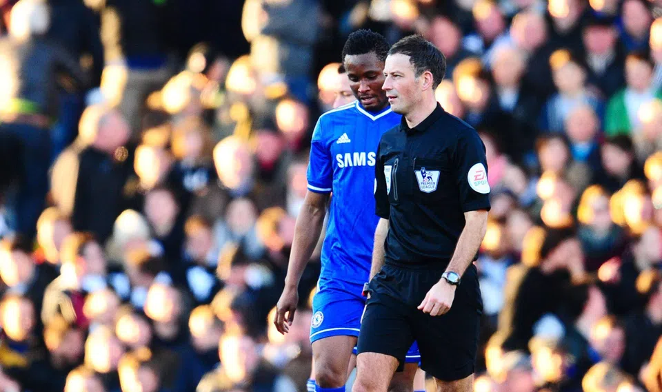 Mark Clattenburg and Mikel Obi