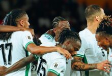 Nigeria Super Eagles players celebrate during 2026 World Cup qualifiers after securing a playoff spot with a 4-0 win over Benin in Uyo.