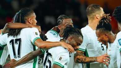 Nigeria Super Eagles players celebrate during 2026 World Cup qualifiers after securing a playoff spot with a 4-0 win over Benin in Uyo.