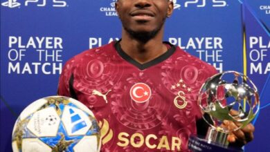 Victor Osimhen holds the match ball and Player of the Match award after scoring a hat-trick for Galatasaray against Ajax in the 2025 UEFA Champions League