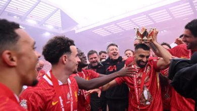 Mohamed Salah celebrating Liverpool’s Premier League title with teammates at Anfield