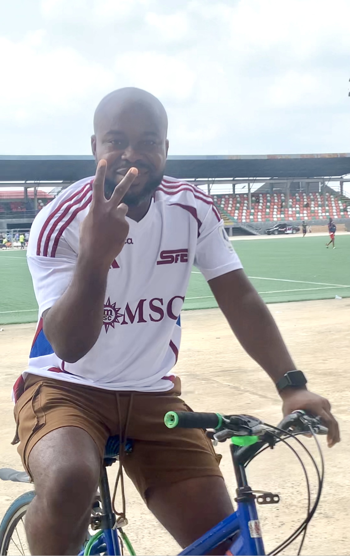 Paul Offor head coach of Akwa United FC riding bicycle At Uyo Township Stadium