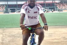 Paul Offor head coach of Akwa United FC riding bicycle At Uyo Township Stadium