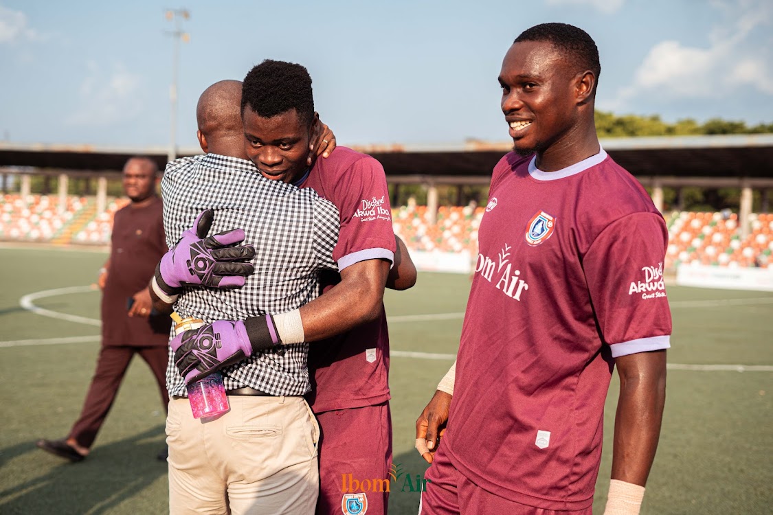 Flying Eagles Invitee Aloysius Uchechukwu Thankgod with Akwa United coach Paul Offor